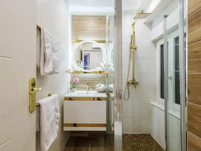 a bathroom with a sink and a mirror at 9 rue Pairoliere in Nice