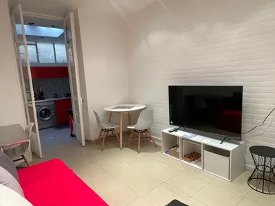 a living room with a large flat screen tv at One-Bedroom Apartment near Promenade des Anglais in Nice