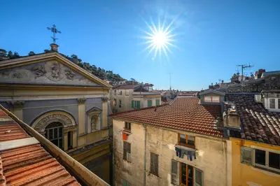 a view of the roofs of buildings in a city at Le Panoramique - Vieux-Nice in Nice