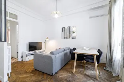 a living room with a couch and a table at Large 2 Bdr City Center close to Train Station in Nice
