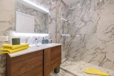 a bathroom with a sink and a shower at PROM 92 - Amazing Sea View 3 rooms with terrace in Nice