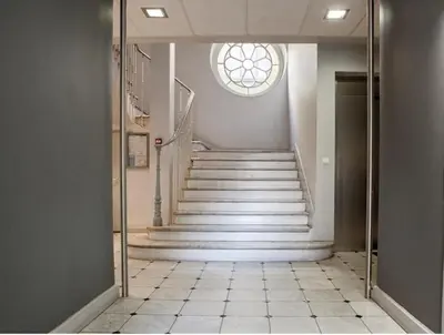 a hallway with a staircase with a window at Small Duplex - Downtown - Close to Beaches in Nice