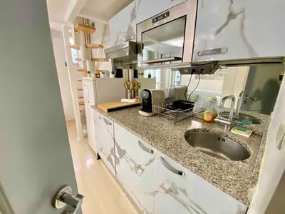 a kitchen with a sink and a counter top at Small Duplex - Downtown - Close to Beaches in Nice