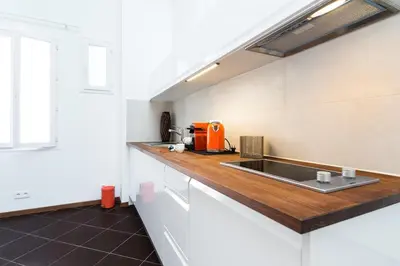 a kitchen with an orange appliance on a counter at loft proche port Nice in Nice
