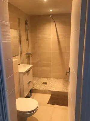 a bathroom with a shower and a toilet and a sink at Studio Libération Piscine centre ville Nice in Nice
