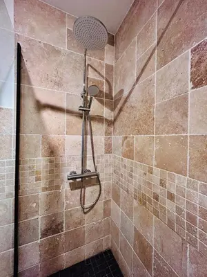 a shower with a shower head in a bathroom at Old Town Immersion-Breakfast-Central-Self Check-in in Nice