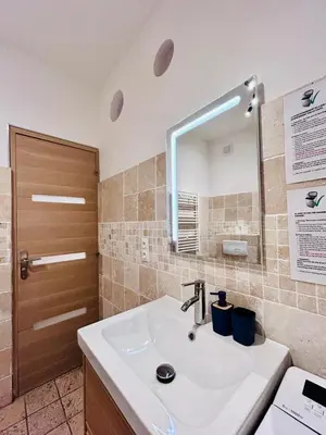 a bathroom with a sink and a mirror at Old Town Immersion-Breakfast-Central-Self Check-in in Nice