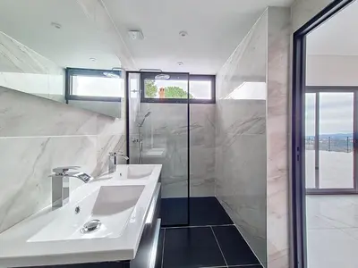 a white bathroom with a sink and a shower at Domaine Datcha - La Dolce Vita, en toute intimité in Aspremont