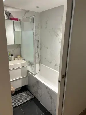 a bathroom with a shower and a sink at Elegant apartment in Nice with a private garden in Nice