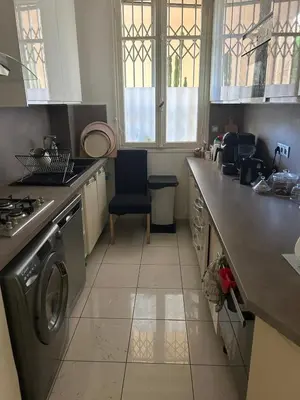 a kitchen with a sink and a dishwasher at Elegant apartment in Nice with a private garden in Nice