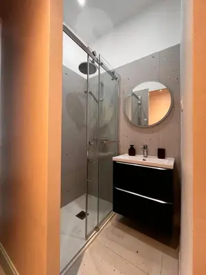 a bathroom with a shower and a sink and a mirror at Chambre arty & colorée en plein cœur de Nice in Nice