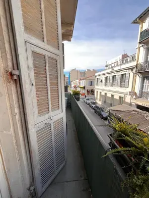 an open door on a balcony of a building at Chambre arty & colorée en plein cœur de Nice in Nice