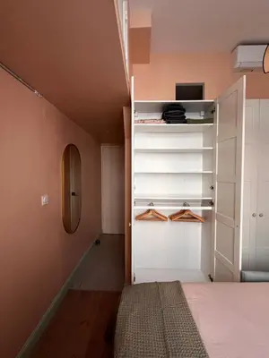 a room with a bed and a closet at Chambre arty & colorée en plein cœur de Nice in Nice