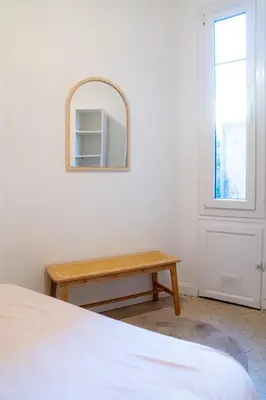 an open door in a room with a couch at Appartement en plein centre-ville in Nice