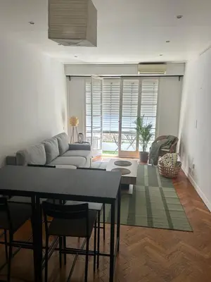 a living room with a couch and a table at Appart Centre ville à 2 min à pied de la mer in Nice