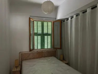 a small bedroom with a bed and a window at Appart Centre ville à 2 min à pied de la mer in Nice