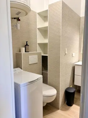 a small bathroom with a toilet and a sink at Studio avec balcon - Centre-ville & plage à 2 min in Nice