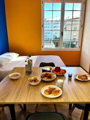 a table with three plates of food on it at Oiseau du paradis studio central pour 4 personnes in Cagnes-sur-Mer