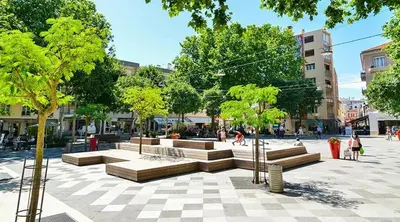 a park with benches and trees in a city at Oiseau du paradis studio central pour 4 personnes in Cagnes-sur-Mer
