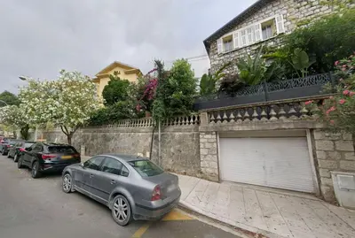 a car parked on a street next to a building at NiceVueEnsoleille in Nice