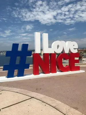 a sign that says i love nida on a sidewalk at Super flat in Carré d'Or - 1 minute from the sea in Nice