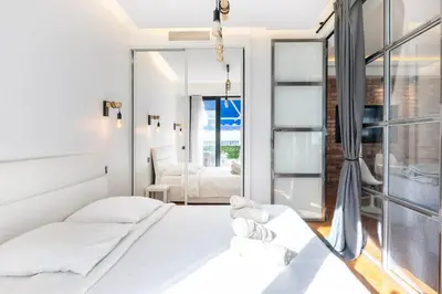 a bedroom with two beds and a large window at Super flat in Carré d'Or - 1 minute from the sea in Nice
