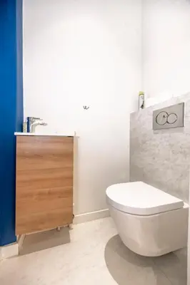 a bathroom with a white toilet and a sink at Super flat in Carré d'Or - 1 minute from the sea in Nice