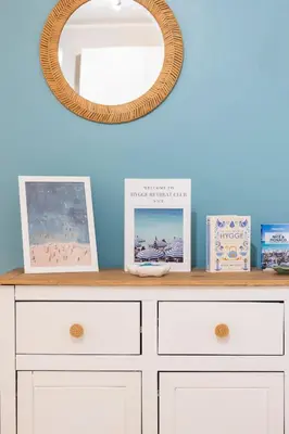 a white dresser with a mirror on top of it at 2 bedroom apartment in the center of Nice old town in Nice