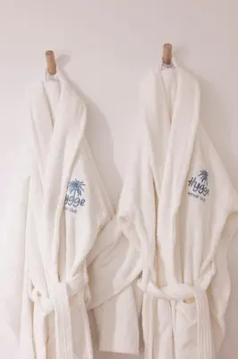 three white towels hanging on a wall at 2 bedroom apartment in the center of Nice old town in Nice