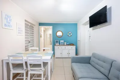 a living room with a couch and a table at 2 bedroom apartment in the center of Nice old town in Nice