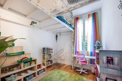 a childs room with a shelf and a table and a chair at Chic 3BR Oasis Near the Sea AC 2 Terraces in Nice
