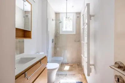a bathroom with a toilet sink and a shower at Chic 3BR Oasis Near the Sea AC 2 Terraces in Nice