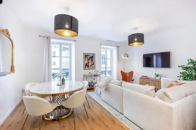 a living room with a couch and a table at Appartement Assalit Two bedrooms in Nice in Nice