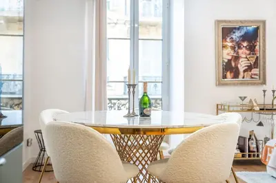 a dining room with a table and chairs at Appartement Assalit Two bedrooms in Nice in Nice