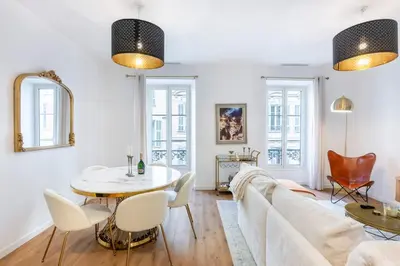 a living room with a couch and a table at Appartement Assalit Two bedrooms in Nice in Nice
