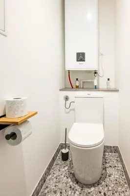 a bathroom with a white toilet in a room at Appartement Assalit Two bedrooms in Nice in Nice