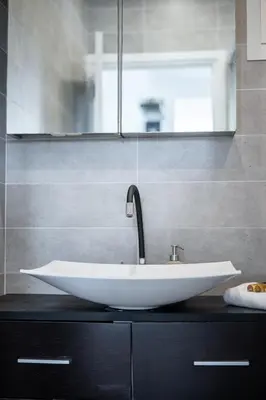 a bathroom with a white sink on a counter at L'Essentiel Confort - Solaire, Plage, Vieux Nice - by Studio Y in Nice