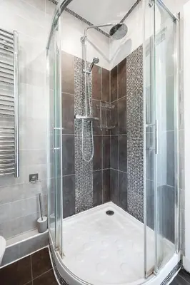 a shower with a glass enclosure in a bathroom at L'Essentiel Confort - Solaire, Plage, Vieux Nice - by Studio Y in Nice