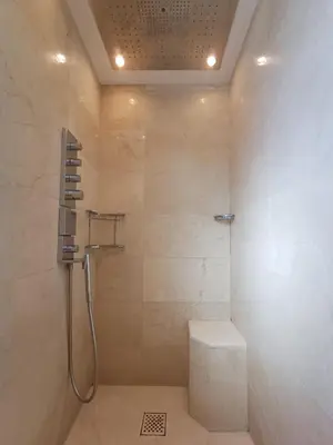a bathroom with a shower with a toilet in it at Penthouse - Vue mer panoramique - SPA privé - Piscine commune in Saint-Laurent-du-Var