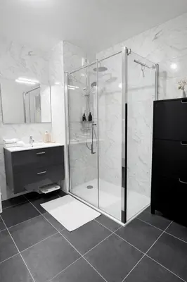 a bathroom with a shower and a sink at Luxury apartment with balcony & rooftop in Nice