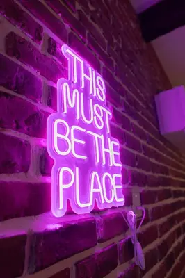 a neon sign that says this must be the place at Loft de 6 couchages, bord de mer à Nice in Nice