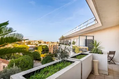 a balcony with a view of a city at 2BR Sea View Apartment with Pool & AC in Cagnes-sur-Mer