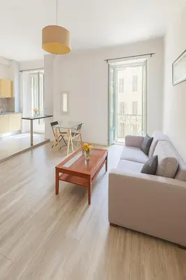 a living room with a couch and a table at Large 1 bedroom apartment, balcony, very central Nice in Nice