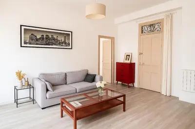 a living room with a couch and a coffee table at Large 1 bedroom apartment, balcony, very central Nice in Nice