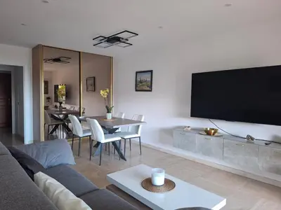 a living room with a large flat screen tv at Heaven Nice in Nice