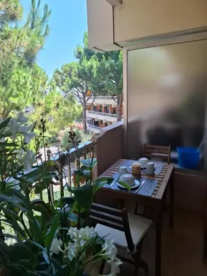 a table and chairs on a balcony with a view at Heaven Nice in Nice
