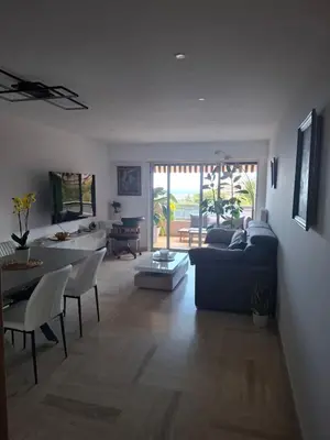 a living room with a couch and a table at Heaven Nice in Nice