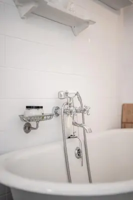 a bath tub with a shower in a bathroom at Maison Nice - Plage 300m - Parking in Nice