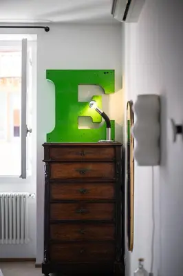 a dresser with a lamp on top of it in a room at Maison Nice - Plage 300m - Parking in Nice