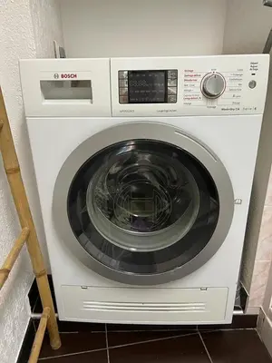 a white washing machine sitting in a kitchen at Old Nice appartement entier proche mer et plage et AC in Nice